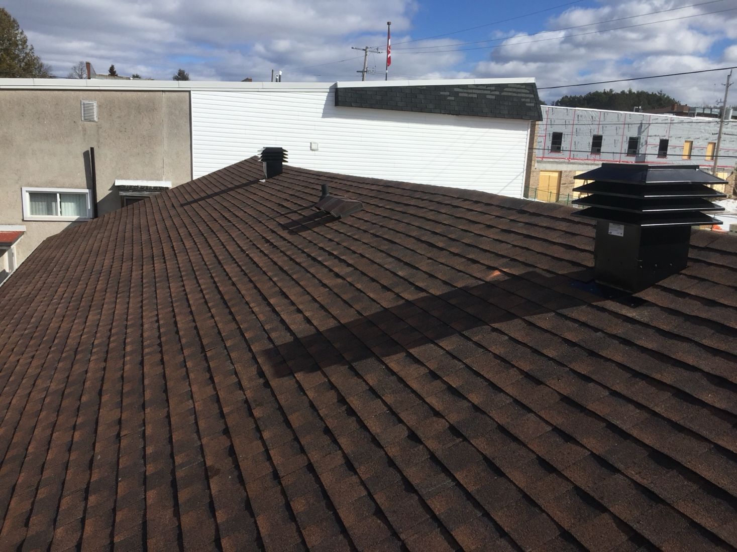 Completed architectural shingle roof with vents
