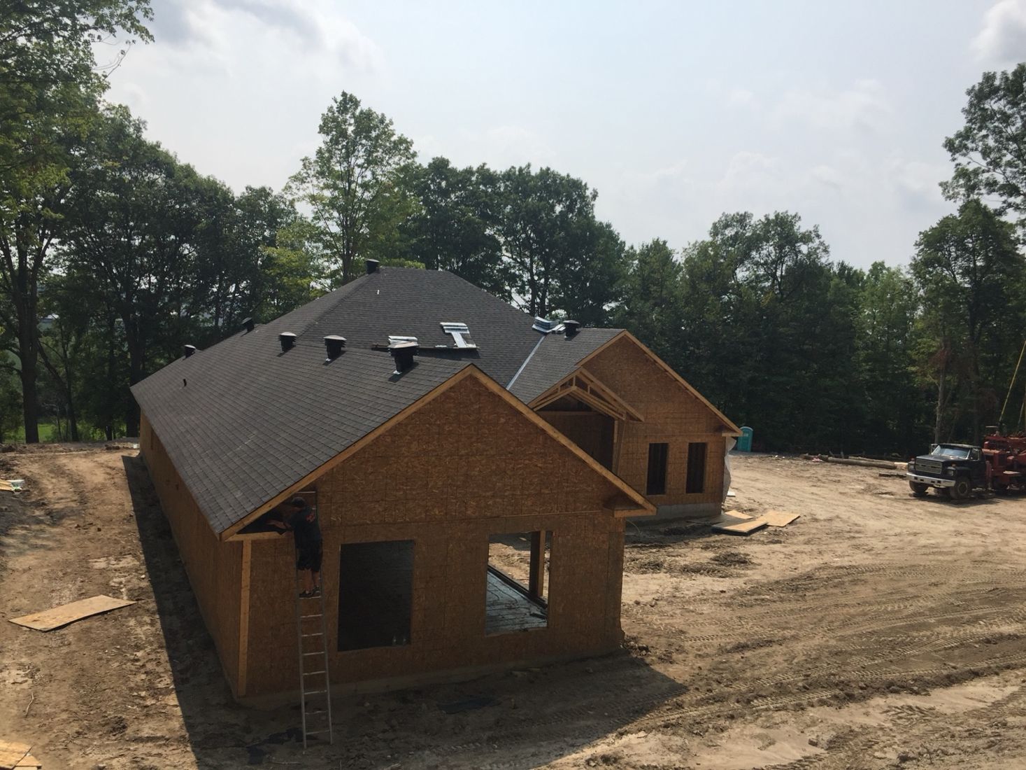 New construction home with shingle roof