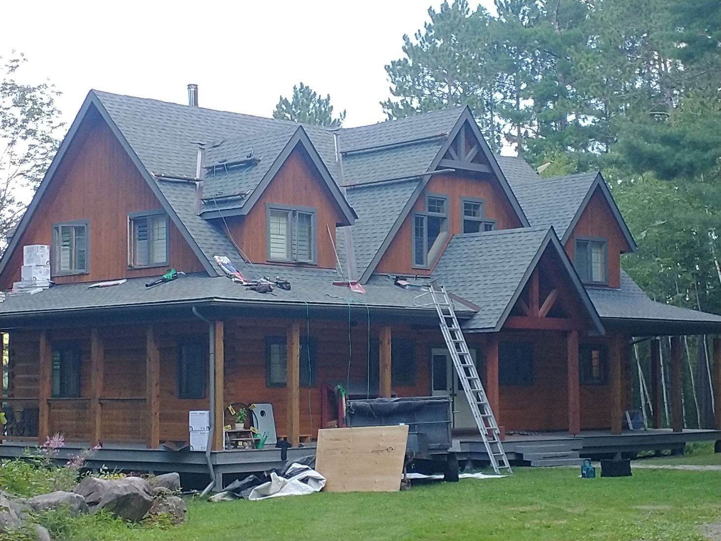 Large timber home roof installation